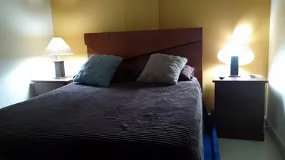 Cama o camas de una habitación en Tesoro Palmas Resort