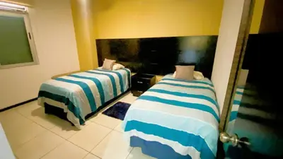 Cama o camas de una habitación en Horizon #2 Esmeralda de Lujo Frente Playa y Malecón