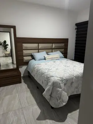 Cama o camas de una habitación en Marina Cerritos condominios