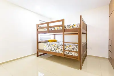 Cama o camas de una habitación en Departamento Moderno de DOS recamaras cerca de la playa, Malecón y Gran Plaza