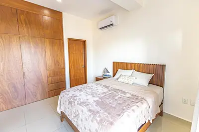 Cama o camas de una habitación en Departamento Moderno de DOS recamaras cerca de la playa, Malecón y Gran Plaza