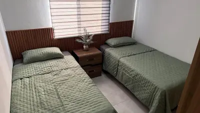 Cama o camas de una habitación en Casa La Amistad Comoda Casa con 3 Habitaciones