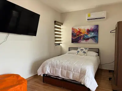 Cama o camas de una habitación en Depa A unas calles de la Playa y Zona Dorada ByGPS