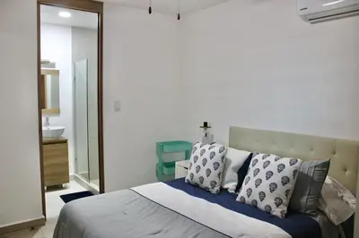 Cama o camas de una habitación en Hermoso departamento con vista al mar