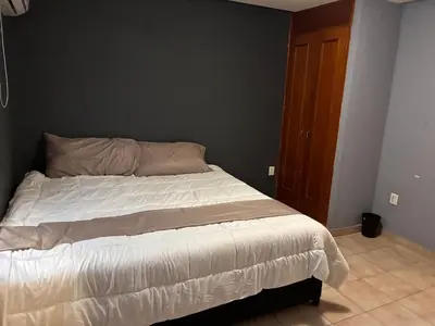 Cama o camas de una habitación en Depa en el Corazon de la Zona Dorada Y Playa