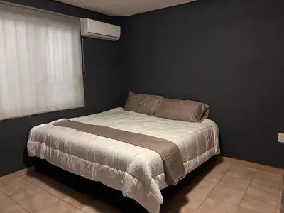 Cama o camas de una habitación en Depa en el Corazon de la Zona Dorada Y Playa
