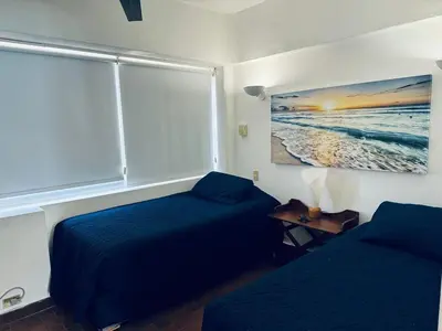 Cama o camas de una habitación en Beachfront apartment with a pool Islas del Sol