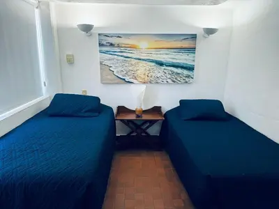 Cama o camas de una habitación en Beachfront apartment with a pool Islas del Sol