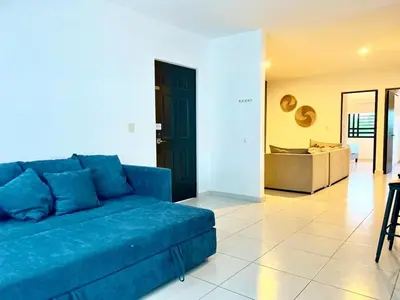 Zona de estar de Departamento Moderno Azul Cielo - 2 Albercas - 3 Min Malecón y Playas
