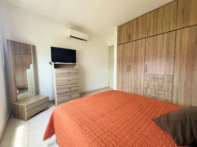 Cama o camas de una habitación en Departamento Moderno Durazno - 2 Albercas - 3 Min Malecón y Playas