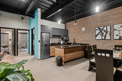 Una cocina o zona de cocina en Industrial Loft King Bed and 2 Office Spaces