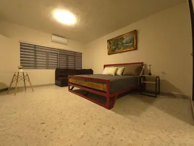 Cama o camas de una habitación en OLYMPIA SUITES sleep local habitaciones ejecutivas