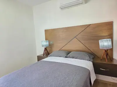 Cama o camas de una habitación en Departamento con vista al Estadio de Béisbol