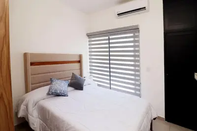 Cama o camas de una habitación en Acogedor departamento con balcon y alberca en roof