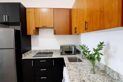 Una cocina o zona de cocina en Acogedor departamento con balcon y alberca en roof