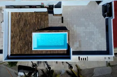 Una televisión o centro de entretenimiento en Acogedor departamento con balcon y alberca en roof