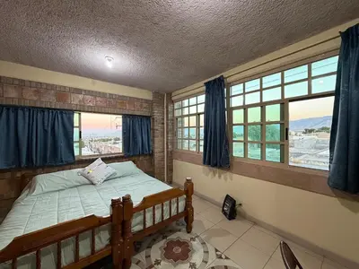 Cama o camas de una habitación en Departamento Nuevo Céntrico con vista hacia la catedral