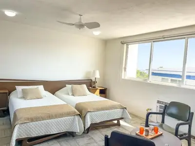 Cama o camas de una habitación en Villa Centenario