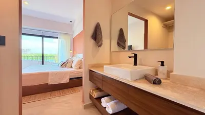 Cama o camas de una habitación en Amhara Marina Mazatlán | Departamentos boutique estilo Tulum a pasos del mar