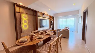 Una televisión o centro de entretenimiento en Amhara Marina Mazatlán | Departamentos boutique estilo Tulum a pasos del mar