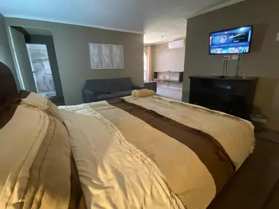 Cama o camas de una habitación en Casa en zona residencial privada, con estacionamiento electrico en Cuauhtemco, Chihuahua