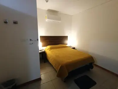 Cama o camas de una habitación en Departamento cerca del aeropuerto
