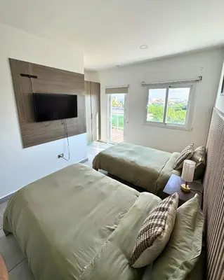 Cama o camas de una habitación en Marina Mazatlán Getaway, Terraza & Comodidad