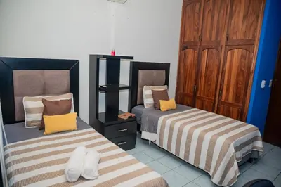 Cama o camas de una habitación en Charming House in Downtown Mazatlan 4 Rooms