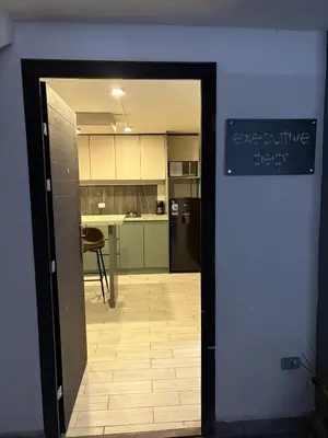Una cocina o zona de cocina en Executive Dept