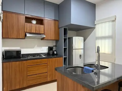 Una cocina o zona de cocina en Alojamiento en Zona Dorada Cerca de la Playa