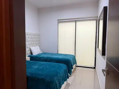 Cama o camas de una habitación en Depa A Unos Pasos de la Playa y Zona Dorada