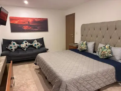 Cama o camas de una habitación en Alojamiento sobre el Malecon con Bonitas Vistas