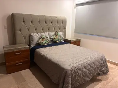 Cama o camas de una habitación en Alojamiento sobre el Malecon con Bonitas Vistas