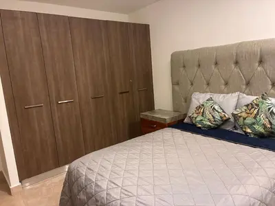 Cama o camas de una habitación en Alojamiento sobre el Malecon con Bonitas Vistas