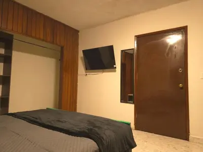 Una televisión o centro de entretenimiento en Habitación en renta