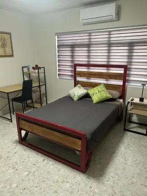Cama o camas de una habitación en Renta de habitación equipada para ejecutivos