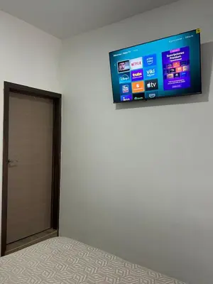 Una televisión o centro de entretenimiento en Departamento Sol