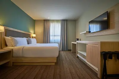 Cama o camas de una habitación en Wyndham Garden Saltillo