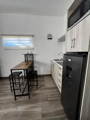 Una cocina o zona de cocina en Departamento LUNA