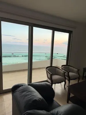 Zona de estar de Departamento frente al mar en Playa Brujas