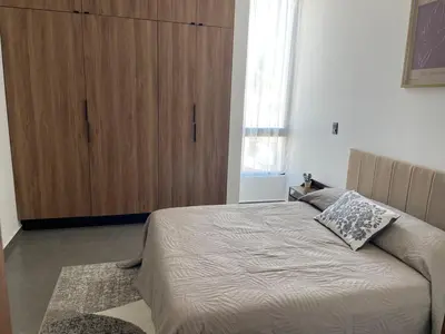 Cama o camas de una habitación en Stylish Condo Steps to Beach & Malecón
