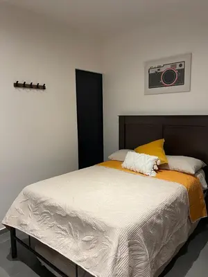 Cama o camas de una habitación en Stylish Condo Steps to Beach & Malecón