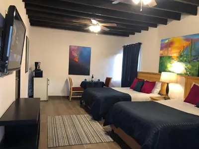 Una televisión o centro de entretenimiento en Casa del Olivo suite 1
