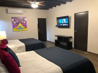 Una televisión o centro de entretenimiento en Casa del Olivo suite 1