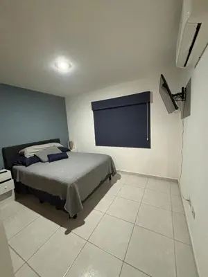 Cama o camas de una habitación en Departamento en privada en Mazatlan, con alberca