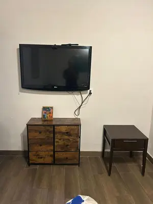 Una televisión o centro de entretenimiento en Casa del Olivo Suite 2
