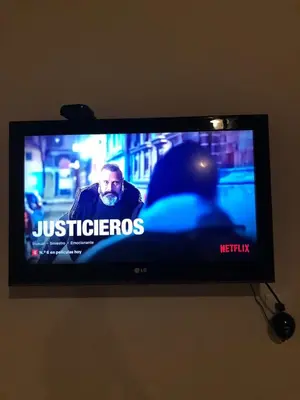 Una televisión o centro de entretenimiento en Casa del Olivo Suite 2