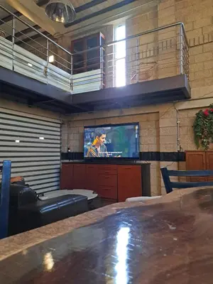 Una televisión o centro de entretenimiento en Loft Mezzanine Mansion Fabulous 2 levels