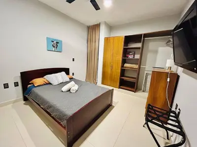 Cama o camas de una habitación en Cerca de la Playa, Alberca en el Roof con Asador