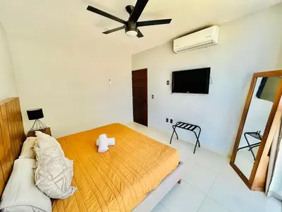 Cama o camas de una habitación en Cerca de la Playa, Alberca en el Roof con Asador
